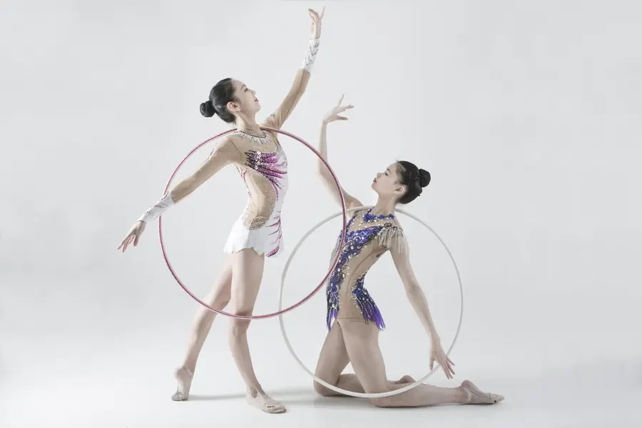 Two gymnasts with hoops